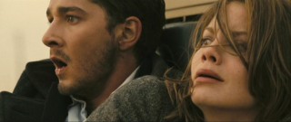 Shocked at how far a villain can stretch credibility, Jerry (Shia LaBeouf) and Rachel (Michelle Monaghan) watch on in horror.