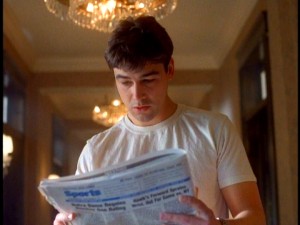 Gary Hobson (Kyle Chandler) takes a close look at tomorrow's newspaper, which he receives for the second of many times on "Early Edition."