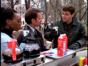 Gary has a coffee cart chat with his two closest friends, Marissa Clark (Shanesia Davis) and Chuck Fishman (Fisher Stevens).
