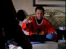 When the heat goes out in his own apartment, Chuck takes over Gary's hotel room, conducting business in bed with a Blackhawks jersey and headset on.