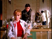 Gary surprises museum artist Emma Shaw (Adrienne Shelly) in her paint-splashed smock.