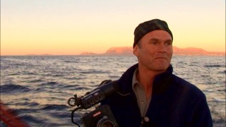 Cameraman Simon Smith tries to press his button at the ideal moment for capturing a slow motion shark feast in "Earth Diaries."
