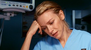 London midwife Anna (Naomi Watts) cries over the baby whose fate is in question in "Eastern Promises."