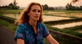 Liz (Julia Roberts) goes back where we started, bicycling to the Balinese medicine man who accurately predicted her life changes.