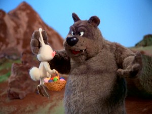 Gadzooks, the big brown bear of Big Rock Mountain, stops Sunny from passing with a basket of "colored stones."