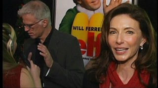 Mary Steenburgen discusses Christmas motherhood while husband Ted Danson talks to a different reporter at the New York City premiere of "Elf."