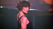 In Eli's prescient vision, Grace (Katie Holmes) is a confident jazz club showgirl. In real life, she is just a clumsy social worker.