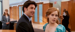 Robert emits a nervous chuckle as Giselle tries to understand his line of work (divorce law). The receptionist in the left side of the frame is played by none other than Jodi Benson, the singing and speaking voice of Ariel in all animated Disney incarnations of "The Little Mermaid."