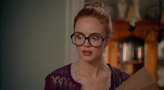 At the film's start, Texas accountant Alexandra Case (Heather Graham) is kind of a nerd, as her large glasses indicate.