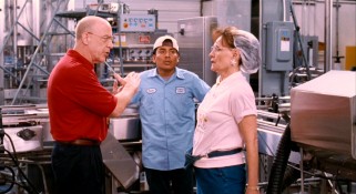 Ever clad in a colorful polo shirt, the factory's impersonal second in command Brian (J.K. Simmons) responds to Mary's (Beth Grant) complaints about new guy Hector (Javier Gutierrez).