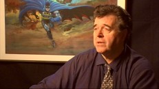 Comic book artist Neal Adams sits in front of the character he's perhaps best known for revitalizing (Batman) while talking about one of his biggest influences in "Jack Kirby: Storyteller."