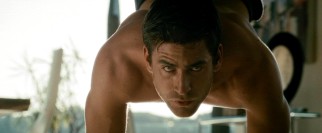 The self-made multi-millionaire, hobby assassin (Oliver Jackson-Cohen) pursuing our lead "beats" yoga in his introductory scene.