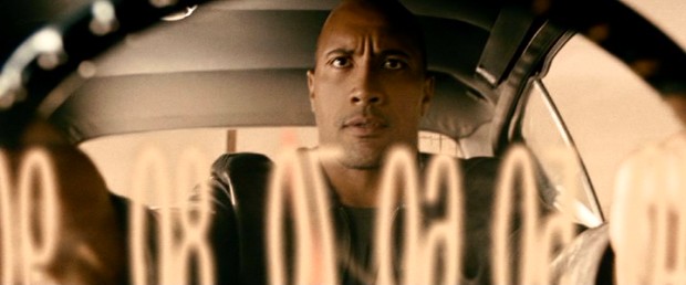 This through-the-speedometer shot enforces the film's title and its driver's (Dwayne "The Rock" Johnson) need for speed.