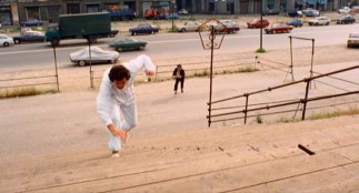 An enraged Luca Canali pursues a reckless van driver in the exciting chase scene at the center of "The Italian Connection."