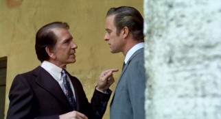 Mafia Don Corrasco (Richard Conte) conspires with corrupt police commissioner Torri (Gianni Garko) in "The Boss."