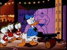 Donald shows off his muscles at the carnival in "Canvas Back Duck."