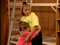 Still frightened by Steve's scary camp story, Michelle and Stephanie grab onto each other in the Season 7 premiere.