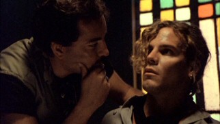 R.J.'s (Craig Sheffer) inquisitive nature and eagerness to photograph do not make him popular with the local police like Sanchez, who questions him as a suspect in front of a stained glass window.