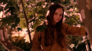 Juli Baker (Madeline Carroll) establishes herself as a literal tree hugger, as she clings to this tall Sycamore scheduled to be chopped down.