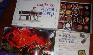 The 15th Anniversary Forrest Gump Giftset includes a book, scratch & sniff chocolate graphics, and a white feather (not pictured).