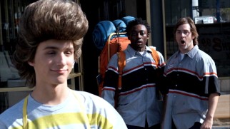 Fred goes through a car wash on foot and the results impress the two clerks (Bambadjan Bamba, John Gatins).