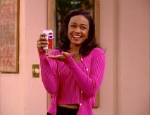 Ashley practices the art of soda advertisement with a can of Pepsi, er, Jet Cola.