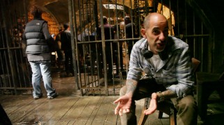Creator David S. Goyer addresses the camera from a prison set in "Constructing Da Vinci."