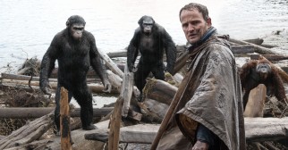 The apes reluctantly allow Malcolm (Jason Clarke) to enter their camp to fix a dam.