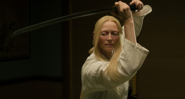 Tilda Swinton plays Zelda Winston, Centerville's new Scottish undertaker who's handy with a sword and secretly an alien.