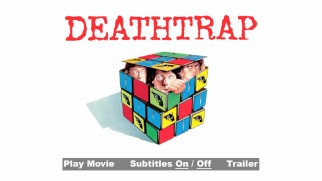 Like the cover and poster, the menu places its three lead actors inside a Rubik's Cube with weapon faces.