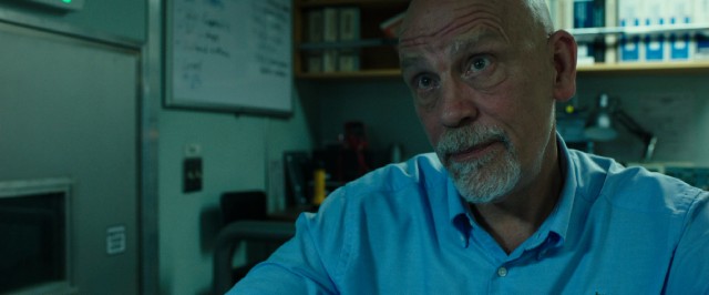 The buttoned-down dress shirt and Cajun accent help us identify Donald Vidrine (John Malkovich) as the villain of the film.