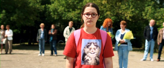 In a cat sweatshirt, Evan van End (Vivian Dierickx) alone awaits the arrival of her family's German exchange student in the Dutch comedy "The Deflowering of Eva van End."