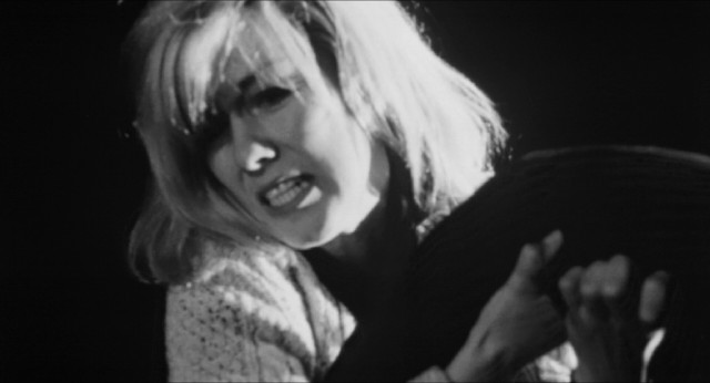 Louise Haloran (Luana Anders) throws her dead husband off the boat in the opening sequence of "Dementia 13."