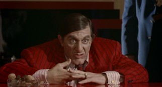 Al Pacino dons a prosthetic nose, chin, and mole for his Oscar-nominated, somewhat career-reviving turn as crime boss Al "Big Boy" Caprice.