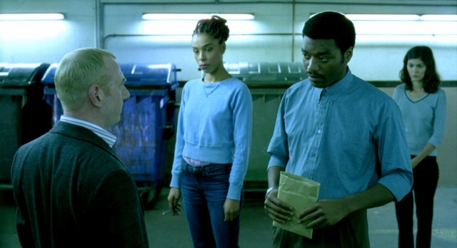 Juliette (Sophie Okonedo), Okwe (Chiwetel Ejiofor), and Senay (Audrey Tautou) team up and get paid in the end of "Dirty Pretty Things."