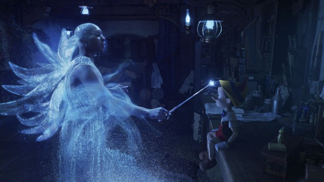 The bald, black Blue Fairy (Cynthia Erivo) grants Geppetto's wish to turn Pinocchio into a real boy...sort of.