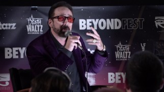 No, that's not Prince. It's Nicolas Cage in tinted sunglasses and a purple dress jacket answering questions at Beyond Fest.