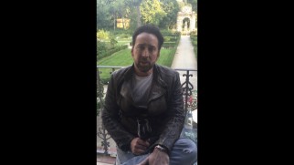 For his taped introduction to the film's Toronto International Film Festival premiere, Nic Cage doesn't even have his phone held the right way.