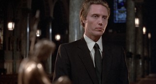 Jamie (Christopher Walken) attends an infant's Baptism in a scene exclusive to the extended international cut of the film.