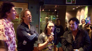 Though shorter and younger than his bandmates, Arnel fits right in with Journey.
