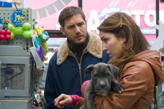 Nadia (Noomi Rapace) helps Bob (Tom Hardy) get what he needs to take care of his new rescued puppy Rocco.