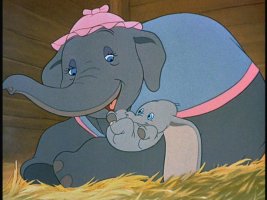 Mrs. Jumbo holds her newborn baby (Dumbo) close to her.