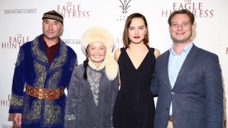 Rys Nurgaiv, Aisholpan, Daisy Ridley, and director Otto Bell pose for a red carpet photo at the Eagle Huntress premiere.