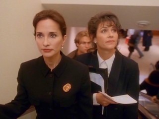 Ebbie Scrooge (Susan Lucci) is all business, to the chagrin of her overworked assistant Roberta Cratchit (Wendy Crewson).