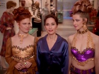 Ebbie (Susan Lucci) is shown Christmases past by perfume counter girls (Jennifer Clement, Nicole Parker) who are supposed to evoke the 1970s here.