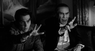 Ed Wood (Johnny Depp) mimics the hand gestures of his new best friend Bela Lugosi (Martin Landau) as they watch a broadcast of one of Lugosi's earlier films.