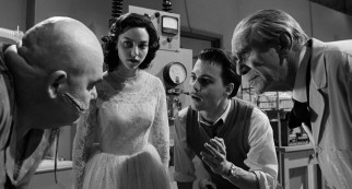 Ed Wood (Johnny Depp) passionately directs Swedish wrestler Tor Johnson (George "The Animal" Steele) through the filming of a science lab scene.