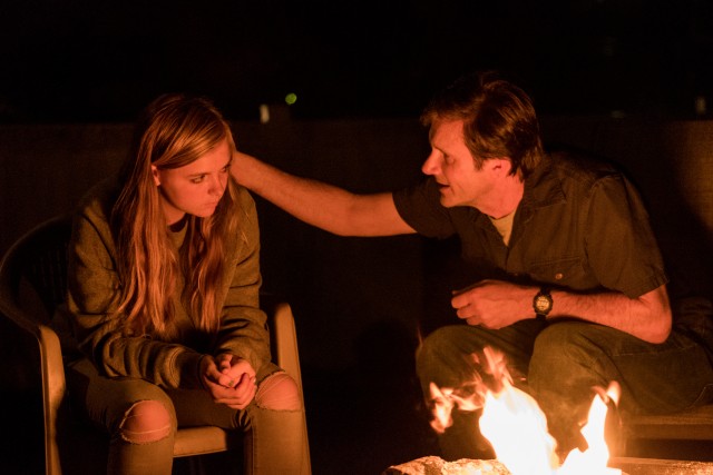 Mark Day (Josh Hamilton) comforts his daughter Kayla (Elsie Fisher) as she burns a time capsule holding her "hopes and dreams" in Bo Burnham's "Eighth Grade", which ranks sixth for the year.