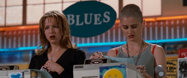 Gina (Rene Zellweger) and Deb (Robin Tunney) trade barbs while checking inventory in "Empire Records."