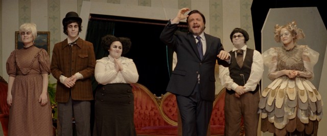 Director Carl Kapinas (Nathan Lane) acknowledges the playwright at the conclusion of "The Chrysalis."